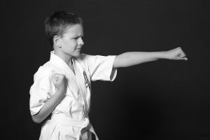 Karate student practicing a front punch