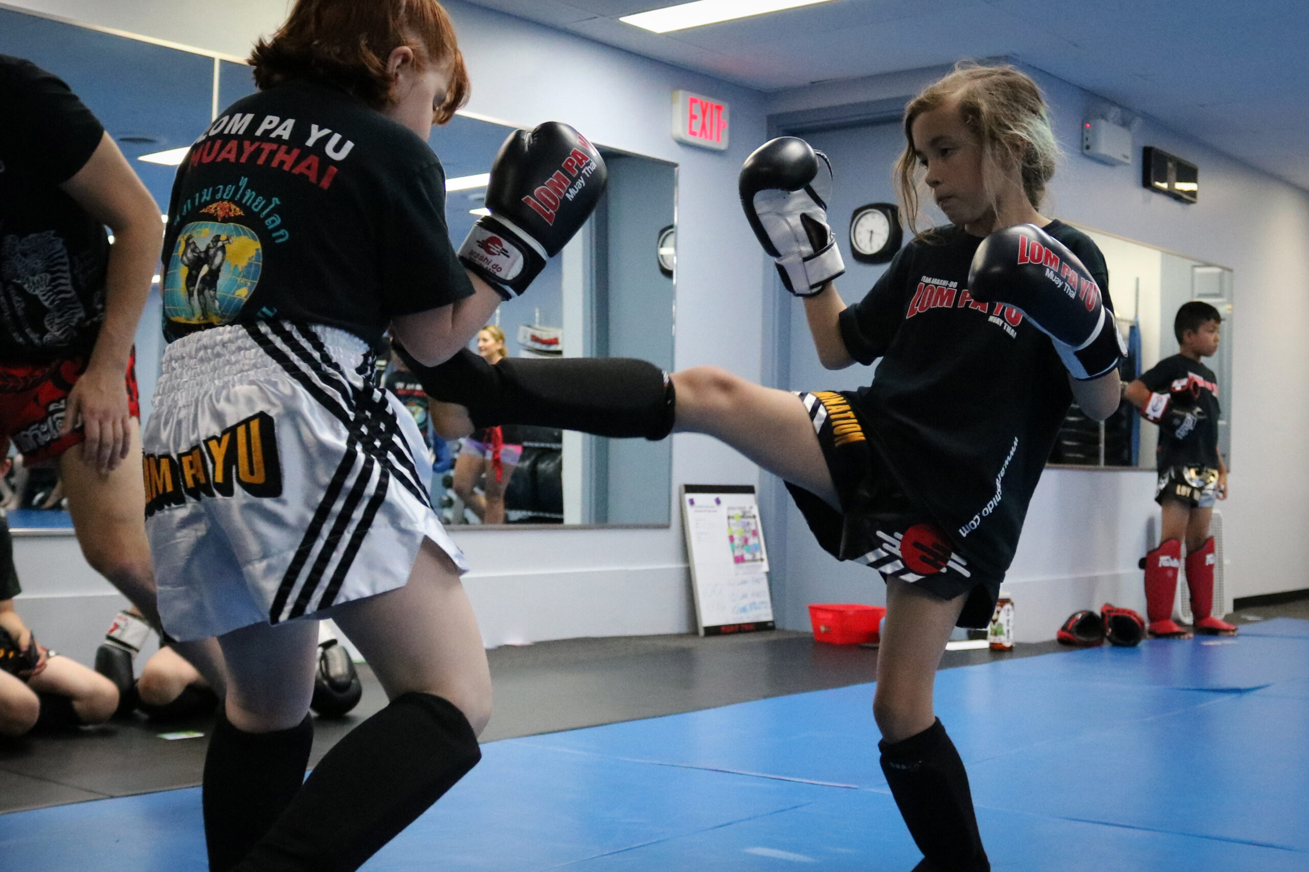 Kids Martial Arts in Calgary, shows two girls lightly sparring