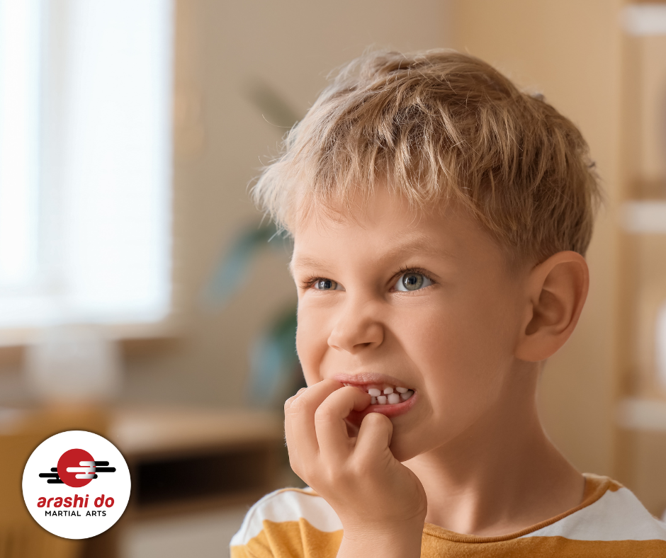 Anxious boy bits nails